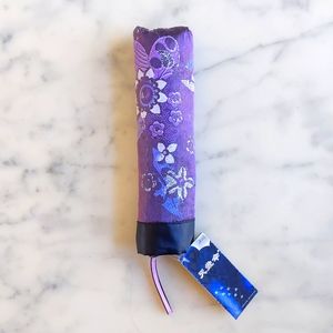 NWT. Color Changing Glitter Purple Floral Tri-Folding Umbrella.